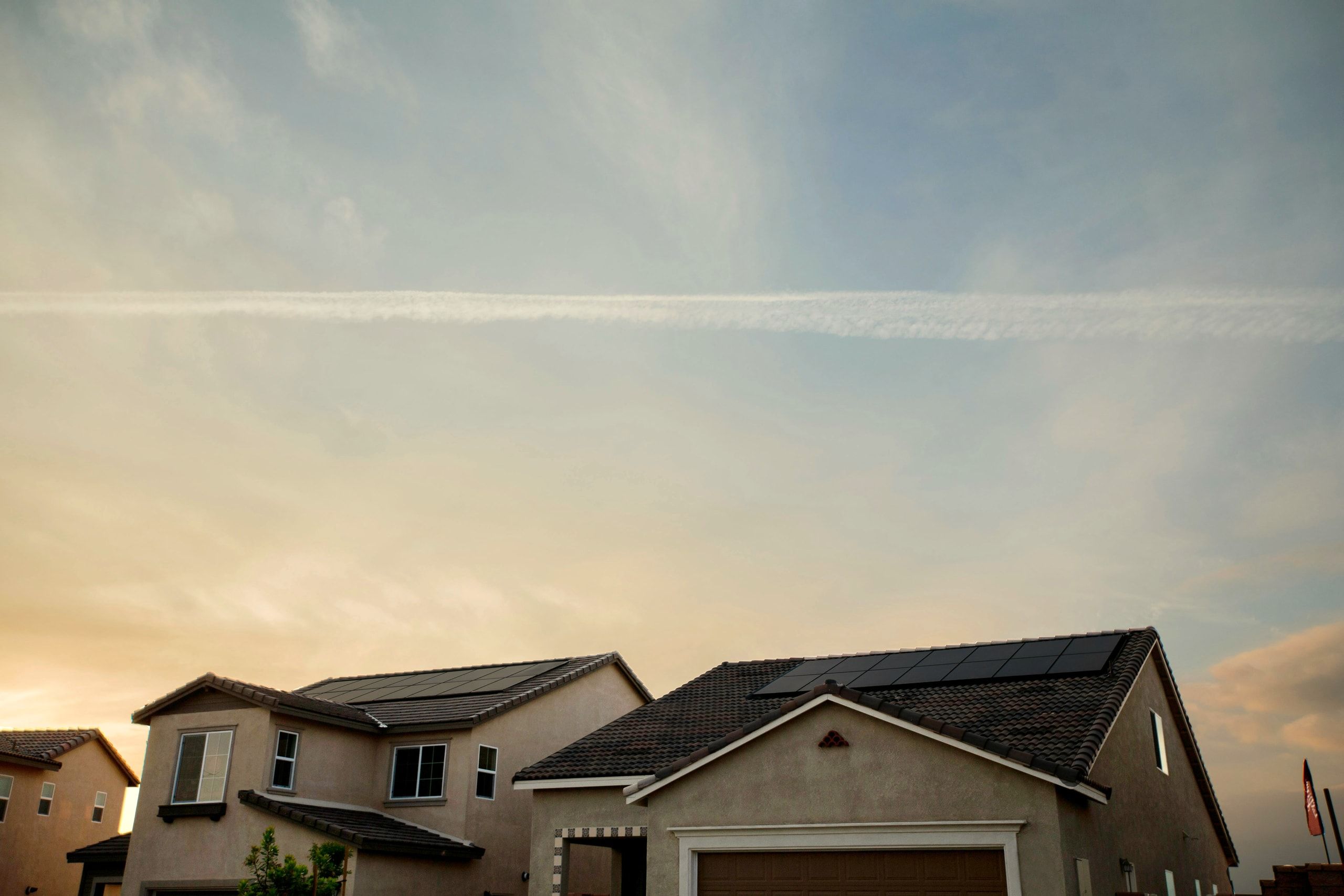 Arizona home with a rooftop solar array under a clear morning sky